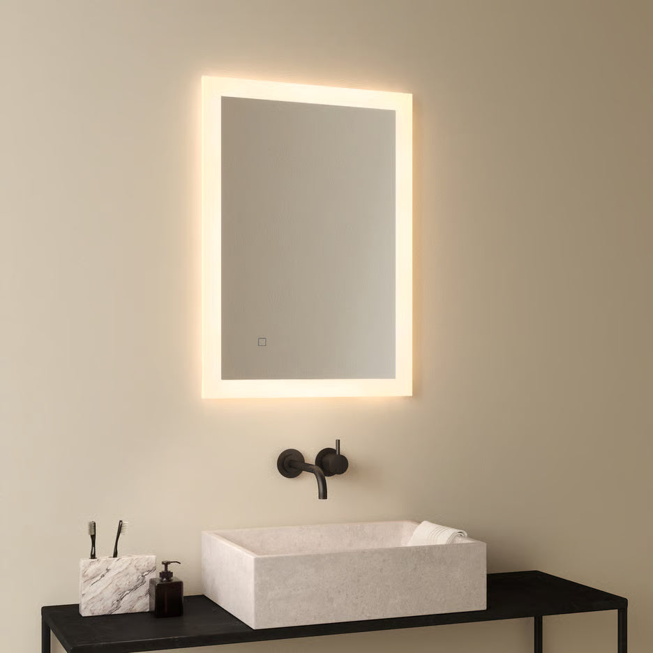 Contemporary Astro bathroom wall light beside a round mirror, providing elegant illumination for modern bathrooms, ensuites and hotel washrooms.